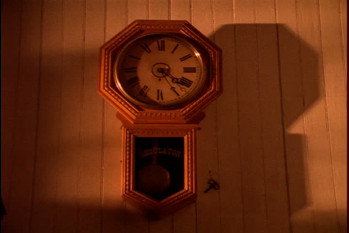 Historical reenactment on Mid Continent Railway, New Freedom, Wisconsin. MS of pendulum clock hanging on wall inside train depot.