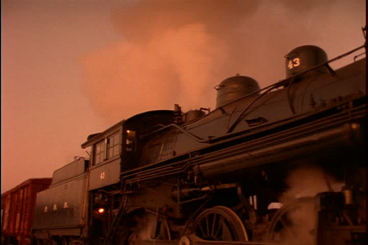 Historical reenactment on Mid Continent Railway, New Freedom, Wisconsin. MS low angle locomotive of 1885 steam train sounds whistle. Camera zooms in to CU whistle on top of locomotive. 