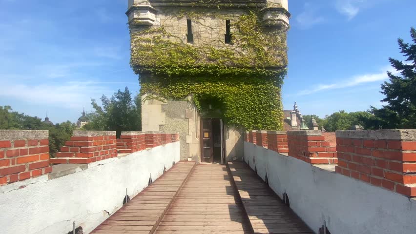 Tower of the medieval walled Vajdahunyad Castle in Budapest on a sunny day with a blue sky, Hungary