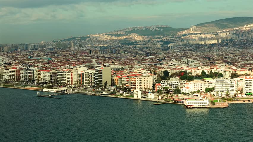 Karşıyaka, İzmir coastline, Kordon, skyscrapers rising along the seafront and the highway stretching along the coast, aerial view of the city.