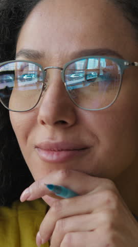 Latina Hispanic student woman in glasses thinking idea writing notebook in library looking away inspiration female girl writer journalist learning knowledge graduate cognition university high school