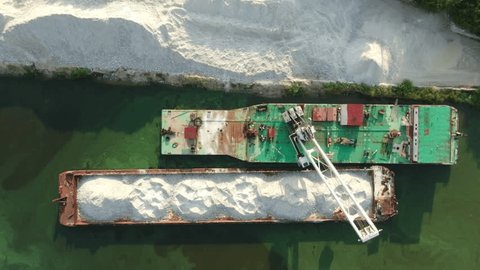 Unloading Sand from Barge with Floating Excavator