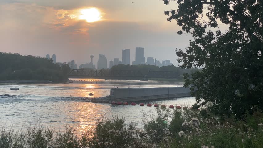 City Calgary by the Bow River with water barrier summer