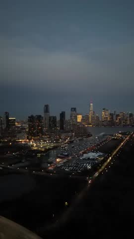 Aerial drone footage of Jersey City and the Manhattan skyline featuring urban architecture, river views, and cinematic movement captured in high resolution.