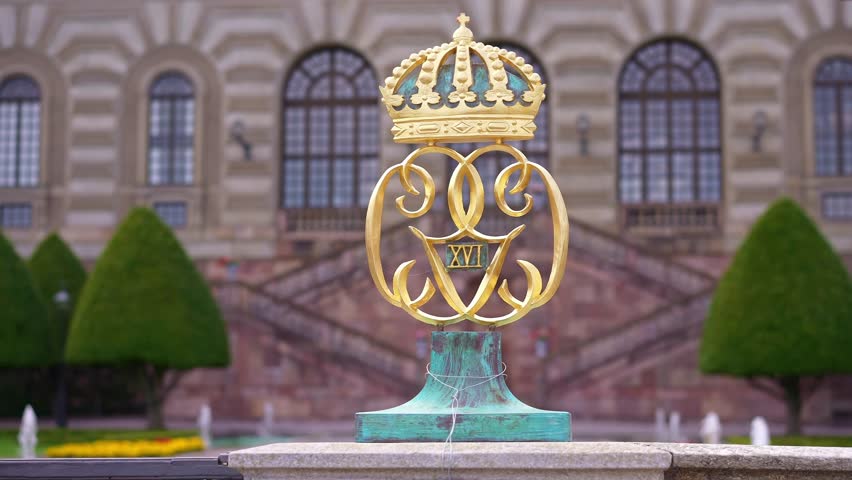 golden crown on the iron fence of Royal Palace in Stockholm. Historic landmark in capital of Sweden. Scandinavian travel tourism destination in Europe.