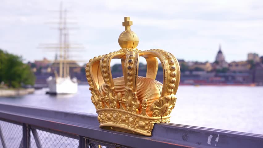 Stockholm bridge with famous royal crown, offer iconic views of the city, Royal Palace and Gamla Stan. Historic landmark in capital of Sweden. Scandinavian travel tourism destination in Europe.