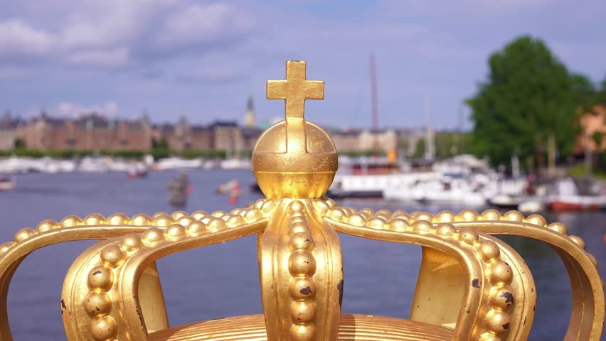Stockholm Skeppsholm Bridge, famous for the two gilded royal crowns, offer iconic views of the city, Royal Palace and Gamla Stan (Old Town).  Scandinavian travel tourism destination in Europe.