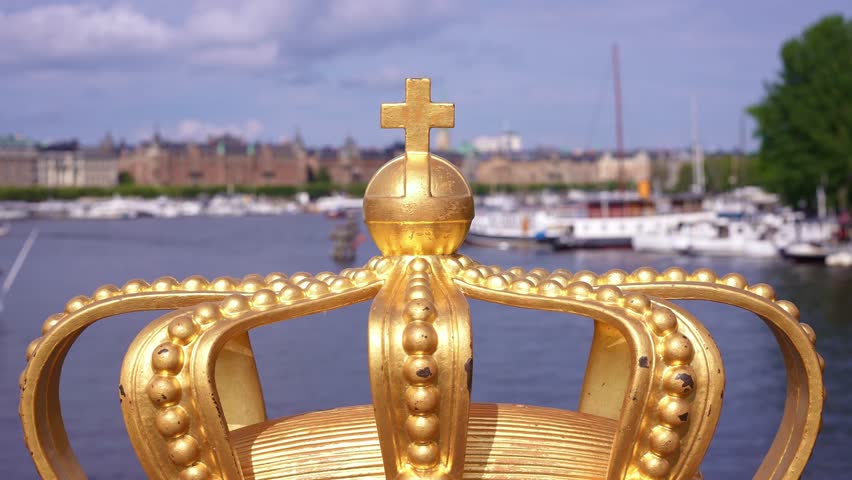 Stockholm bridge with famous royal crown, offer iconic views of the city, Royal Palace and Gamla Stan. Historic landmark in capital of Sweden. Scandinavian travel tourism destination in Europe.