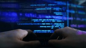 Man work on laptop computer keyboard with user interface of big data science technology, digital network connection and programming algorithm. programmer Hacker Breaching Company server Cyberattack - Powered by Shutterstock - Get 15% off with code: PIKWIZARD15