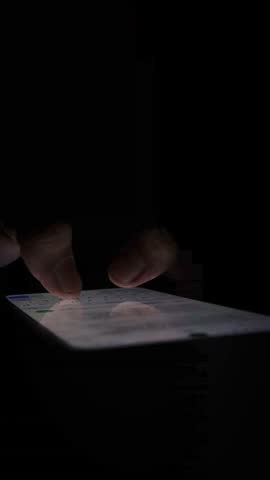 Night, cybersecurity and hands typing with phone for texting, internet troll or person cyberbullying. Dark comment, social media netizen or keyboard warrior, online bullying or hacking. Vertical. 