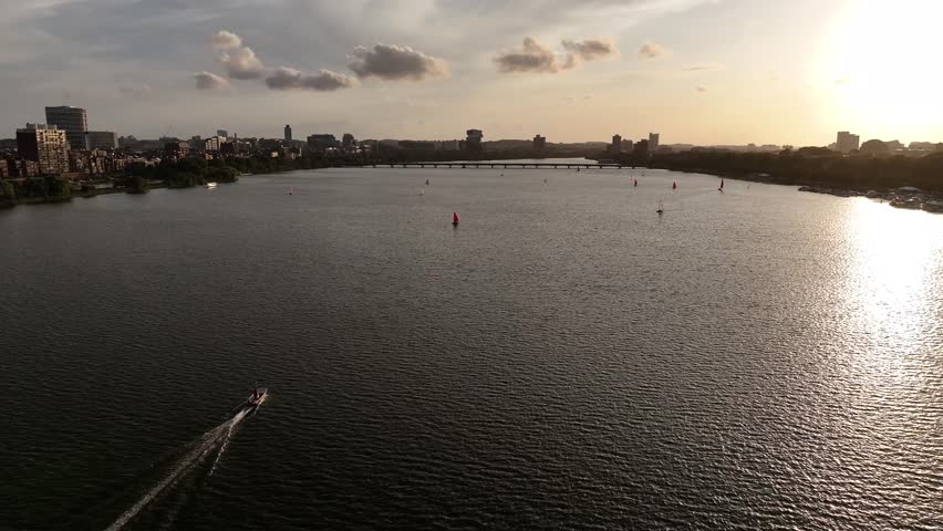 Aerial view of boats sailing on the Charles River with the city skyline and Longfellow Bridge in the background, Boston, Massachusetts, United States.