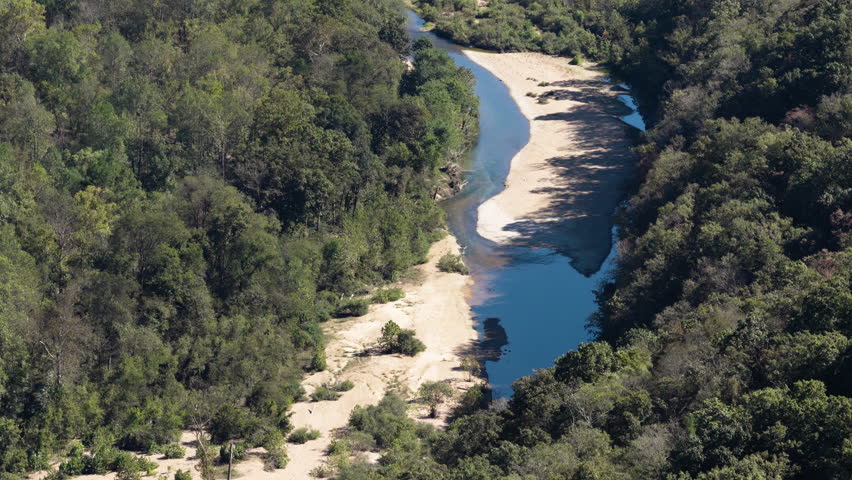 Above View Of Narrow River With Sandbanks Through Forest In Devils Backbone Wilderness In Missouri, USA. Aerial Shot