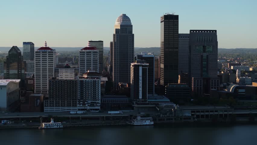 Amazing Aerial View of Louisville, Kentucky Skyline at Sunrise. Tracking Shot
