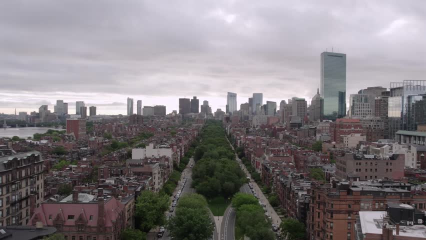Aerial view of buildings and skyscrapers in Boston, with a long road cutting through the center, Boston, Massachusetts, United States.
