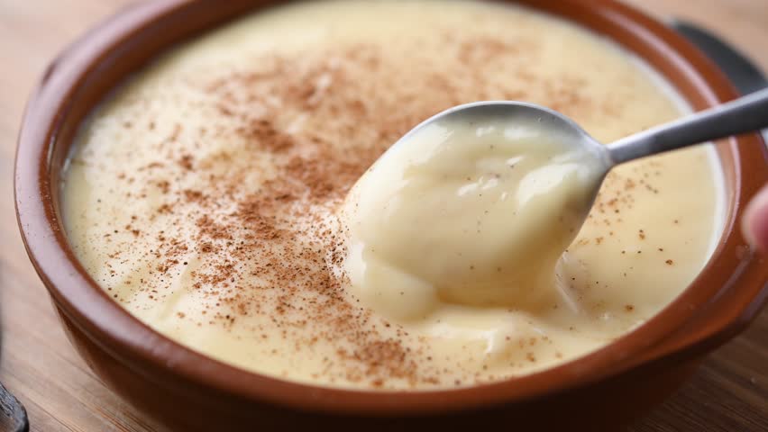 Creamy homemade Spanish custard served in a bowl with cinnamon