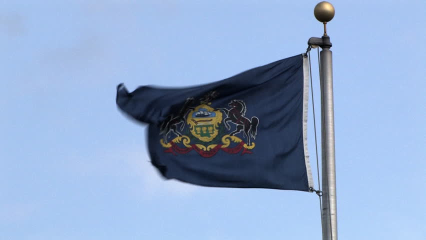 The Pennsylvania State Flag blowing in the wind.
