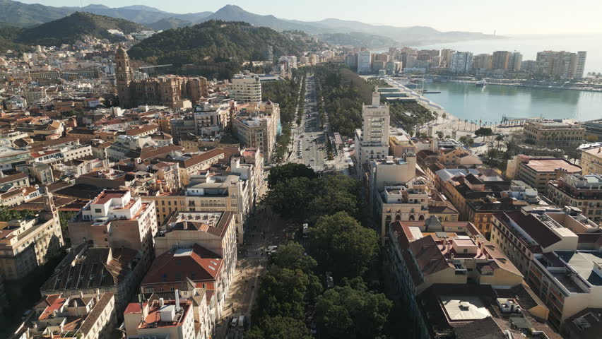 Captivating drone capture unveils an urban panorama of central Malaga, a coastal city in southern Spain. Aerial video.