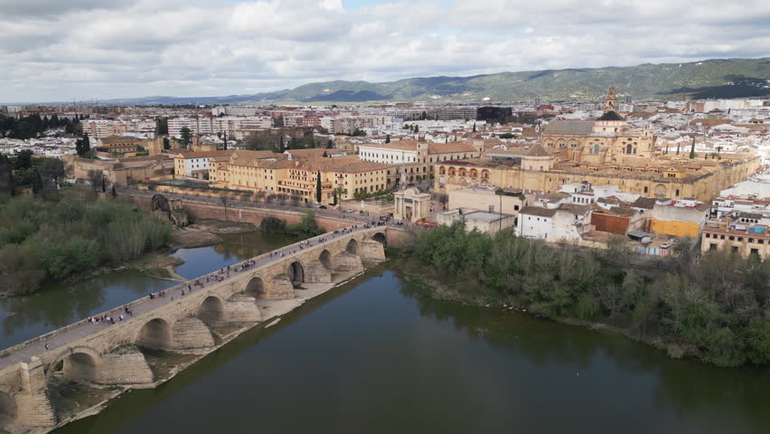 Drone video showcases a scenic panorama of Cordoba, a historic town nestled on the banks of Guadalquivir River in the heart of Andalusia province, southern Spain.