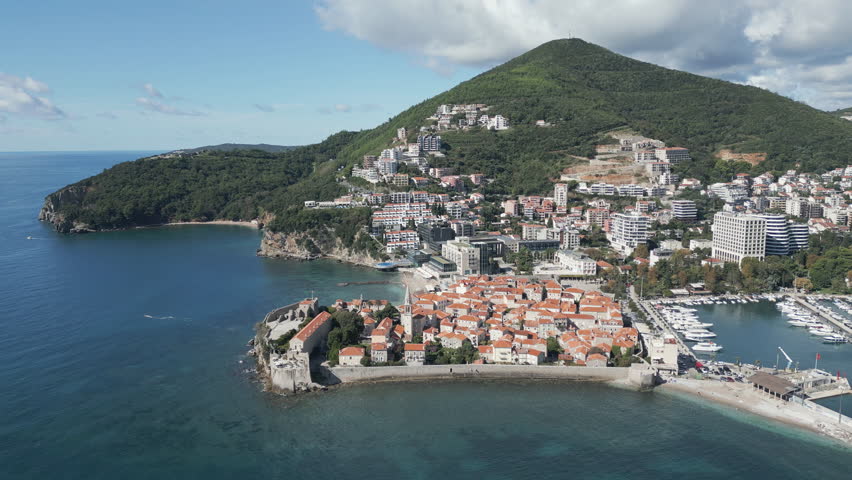 Establishing aerial video of Budva, Montenegro. Drone capture, flying forwards.