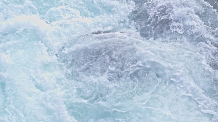 Explore rapid white water flow in Thingvellir, Iceland on a sunny day