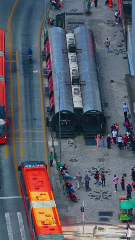 Curitiba, Parana, Brazil - December 28, 2025. Curitiba Downtown BRT Transit Traffic Late Day Street Scene Curitiba