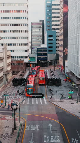 Curitiba, Parana, Brazil - December 28, 2025. Curitiba Downtown BRT Transit Traffic Late Day Street Scene Curitiba