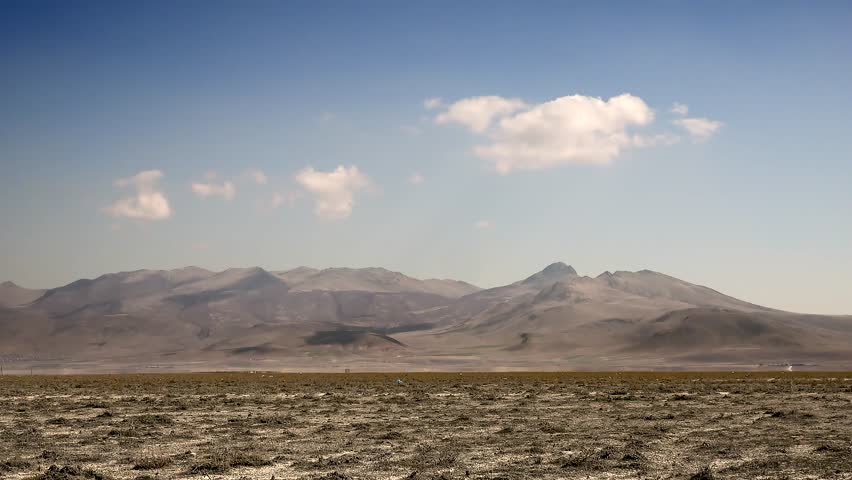 Time lapse of cloud formation over the Nevada Mojave Desert in America. Moisture condenses in dry air, creating a serene sky change in the desert.