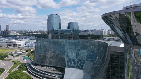 Aerial Circular Flight around Glass Office Buildings