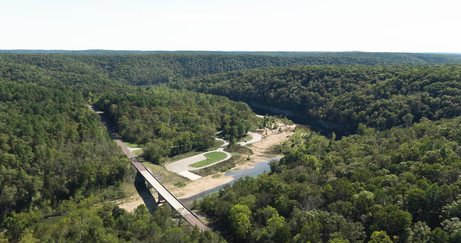 Bridge Across North Fork River Near Campground And Devils Backbone Wilderness In Missouri, USA. wide aerial shot