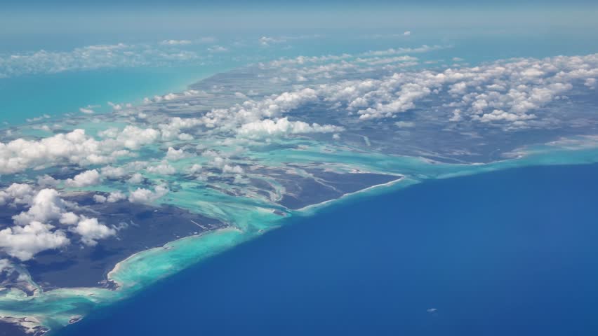 Clouds Covering Caribbean Island With Blue Sea