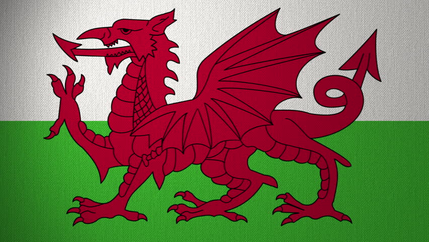 Flag of Wales flutters in the wind. Looping animation background. Travel concept.