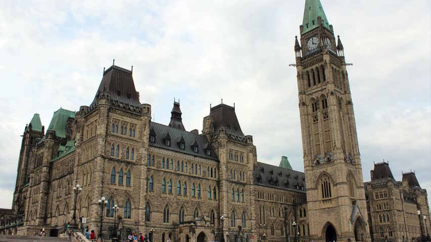 Gothic Revival Architecture of Parliament Hill Centre Block in Ottawa, Canada

outdoors, democracy, green, democratic, east, travel, city, old, cityscape, building, landscape, parliament hill, house, exterior, view, legislature, east block, authority, senate, canada, hill, clock, gothic, sky, tower, architecture, ottawa, national, ontario, government, parliament, clouds, tourism, canadian, flag, capital, buildings, history, landmark, peace, stone, bell, leaf, revival, historic, roof, tall, library, space

A wide architectural shot of the iconic Centre Block on Parliament Hill, featuring the Peace Tower under a bright sky. Perfect for travel documentaries and Canadian political news.