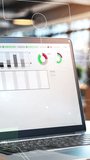 Laptop showing trading platform with graphs and exchange rate in modern office - Powered by Shutterstock - Get 15% off with code: PIKWIZARD15