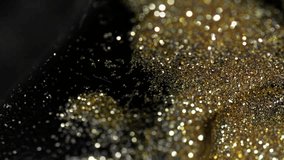 Golden Abstract Liquid glitter particles flowing over a dark surface, perfect for VFX overlays, cinematic backgrounds, luxury branding, celebration edits, motion graphics and creative visual effects. - Powered by Shutterstock - Get 15% off with code: PIKWIZARD15