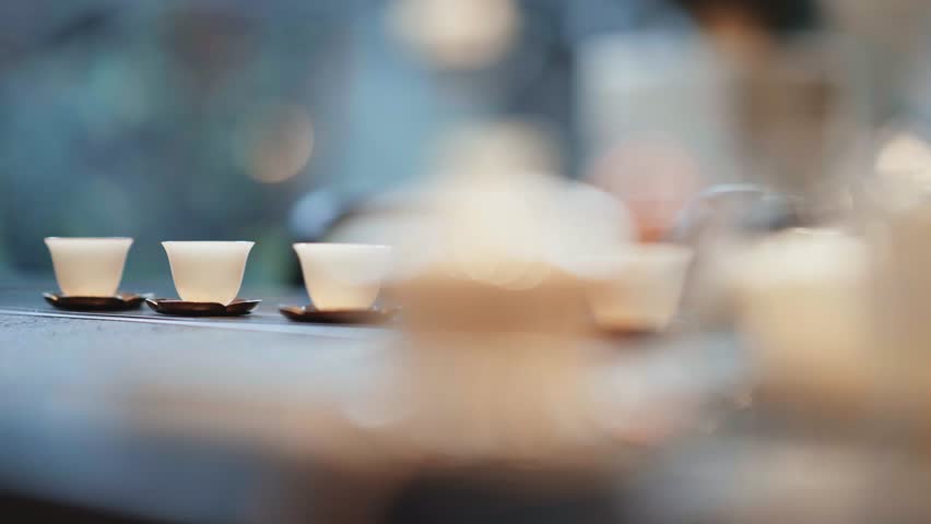 row of tea cup on table