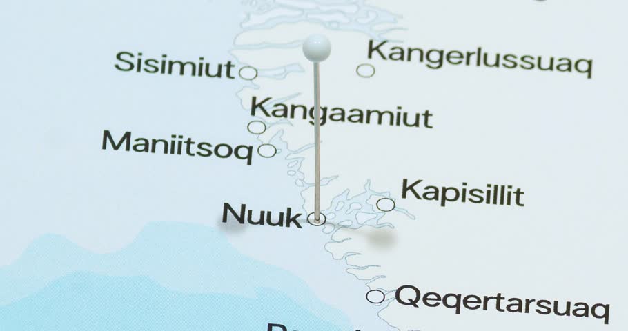 A zoom out of a white pin into nuuk city of greenland political map