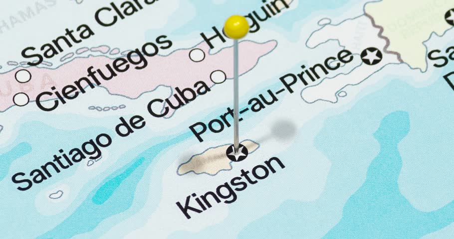 A zoom out of a yellow pin into kingston city of jamaica political map