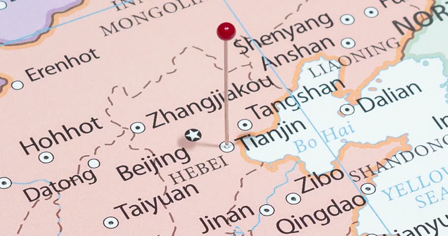 A zoom out of a red pin into tianjin city of china political map
