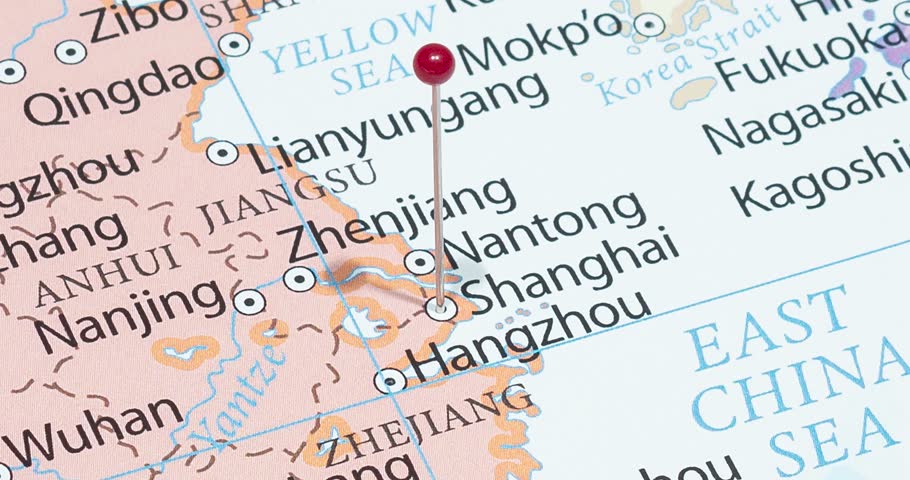 A zoom out of a red pin into shanghai city of china political map