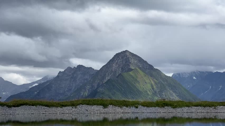 Beautiful mountain landscape with a lake in the foreground