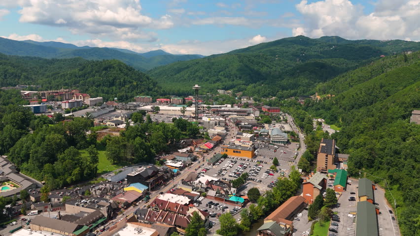 Gatlinburg, Tennessee. Popular resort town surrounded by Appalachian mountain hills, featuring the main Parkway lined with shops, restaurants, and tourist attractions.