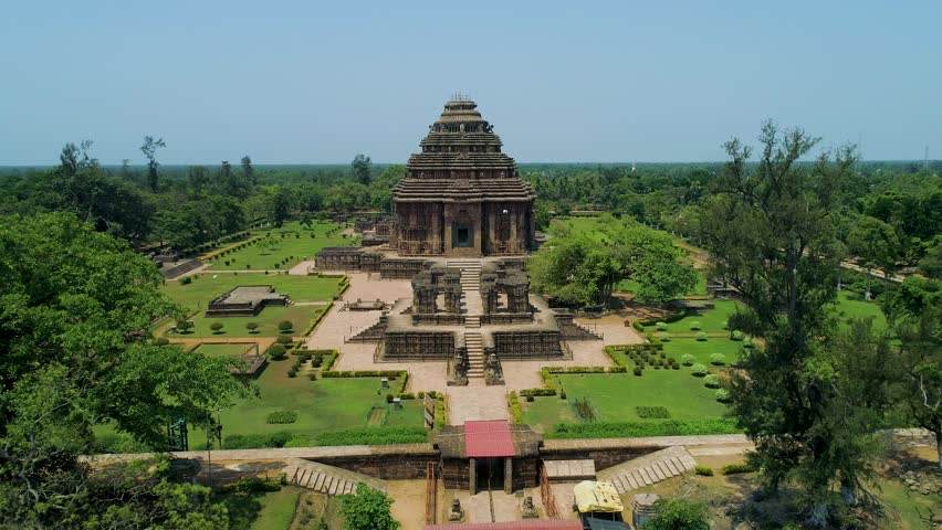 Captivating drone footage showcasing the grandeur of Konark Sun Temple, a 13th-century masterpiece of Kalinga architecture, with its intricately carved wheels and majestic chariot design.