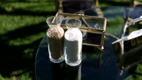 Two glass jars filled with white and brown grains on glass table - Powered by Shutterstock - Get 15% off with code: PIKWIZARD15