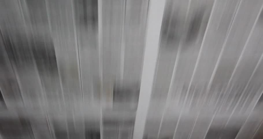 Long newspaper pages moving on a conveyor at a printing office. for news background
