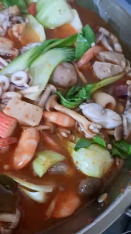 Delicious Hot Spicy Seafood Tom Yum Soup, Concept of Thailand Cuisine, Spicy and Sour Shrimp and Squid Soup, and Authentic Seafood Dish