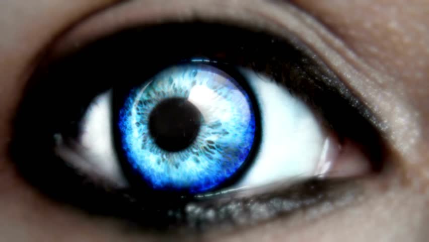 Blue eye opening widely. Macro close-up. Slow motion. opening human iris beautiful blue eye healthy eyesight awareness concept Shot on Cinema Camera.