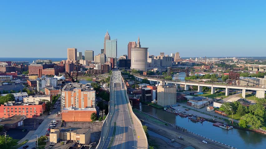 Drone video of Detroit Avenue leading into Downtown Cleveland skyline, Ohio, USA