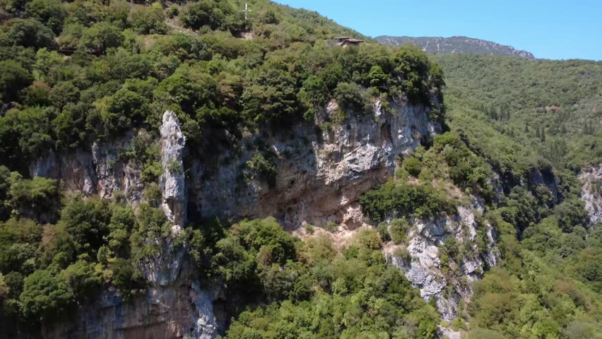 Large White Christian Cross Above Gorge in the Mountains, Greece