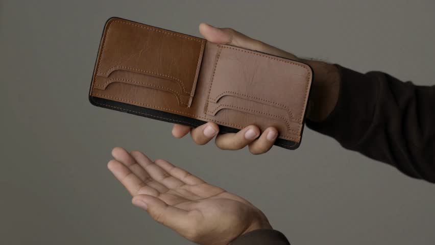 Closeup 4k video of a young businessman shaking her empty wallet without money cash wealth business