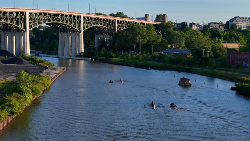 Boats on Cuyahoga River under Lorain-Carnegie Bridge, Cleveland, Ohio, USA